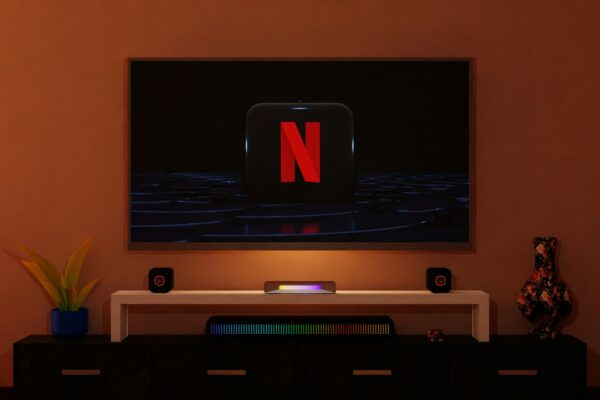 a flat screen tv sitting on top of a entertainment center