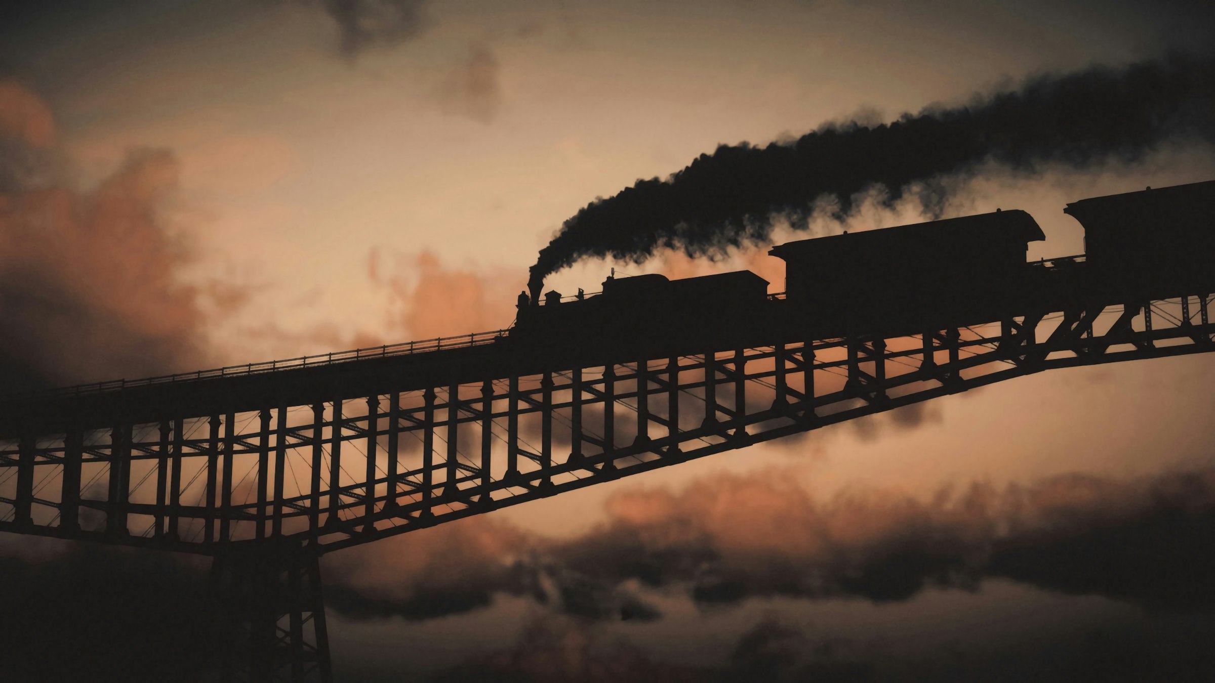 a train traveling over a bridge with smoke pouring out of it