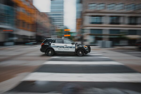 black and white police car on road during daytime