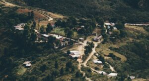 A small village nestled in a lush green hillside.