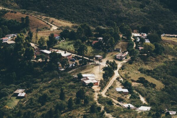A small village nestled in a lush green hillside.