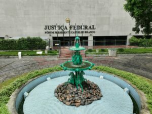 a green fountain in front of a building