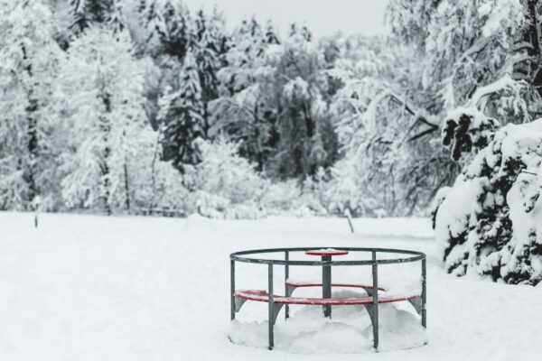 red metal frame on snow covered ground