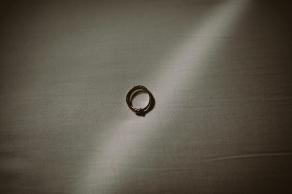 silver ring on gray textile