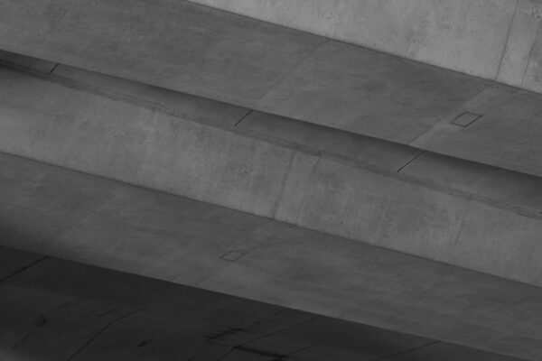 A black and white photo of a person on a skateboard