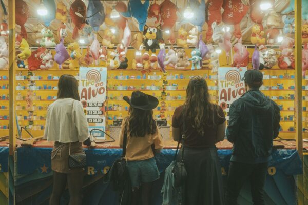People play a game at a carnival.