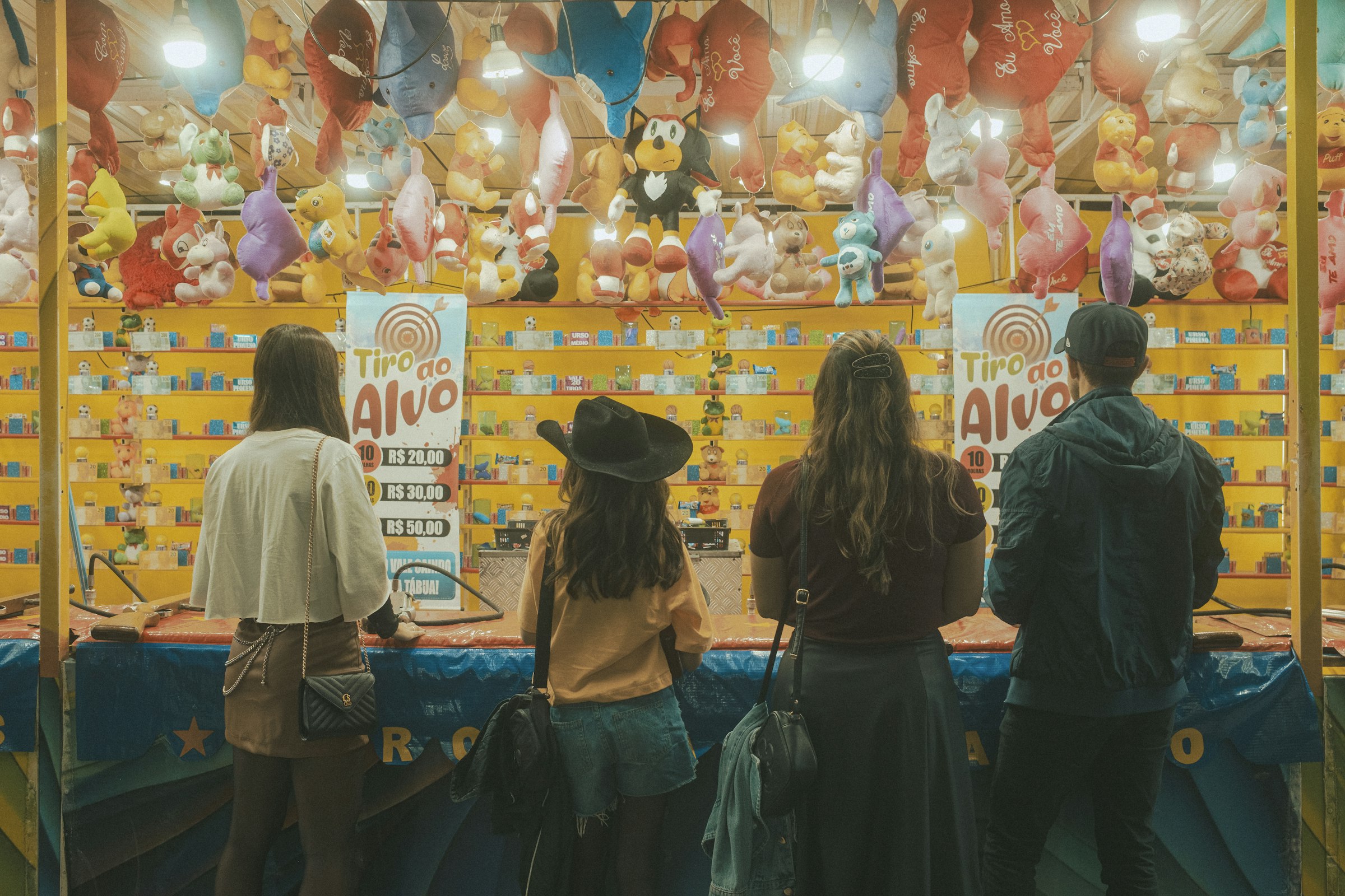 People play a game at a carnival.