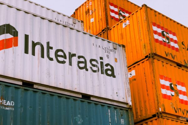 a stack of shipping containers with the word interasia on them