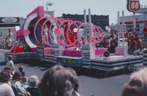 a float with a woman on it in a parade