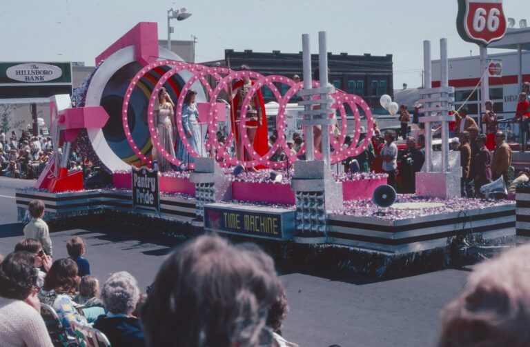 a float with a woman on it in a parade