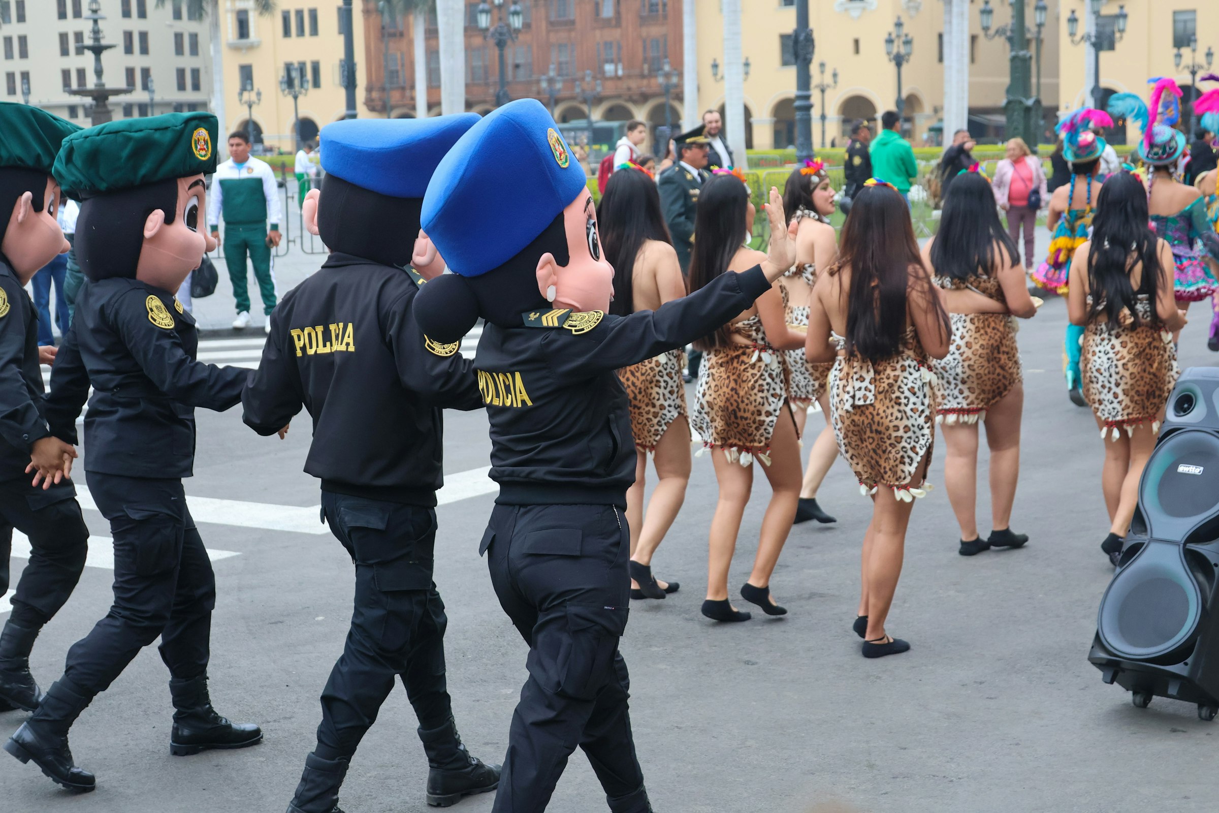 A group of people that are standing in the street