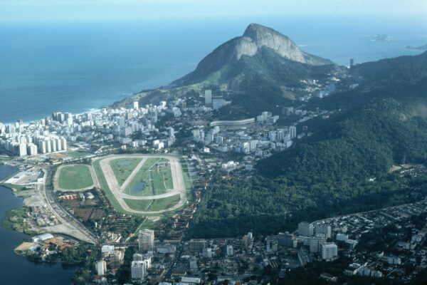 Aerial view of a coastal city with mountains and ocean