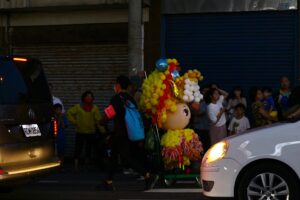 A parade float in the middle of a city street