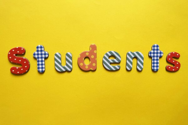 a yellow background with the word students spelled out