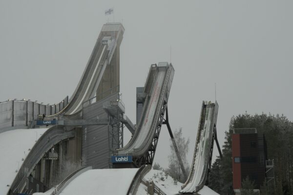 a snow covered hill with a slide going down it
