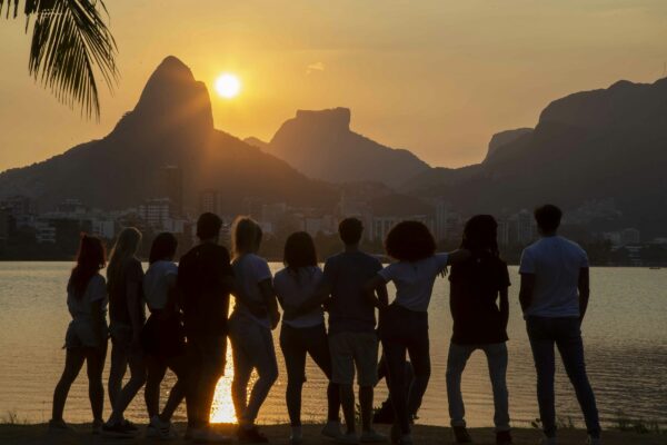 people standing near body of water